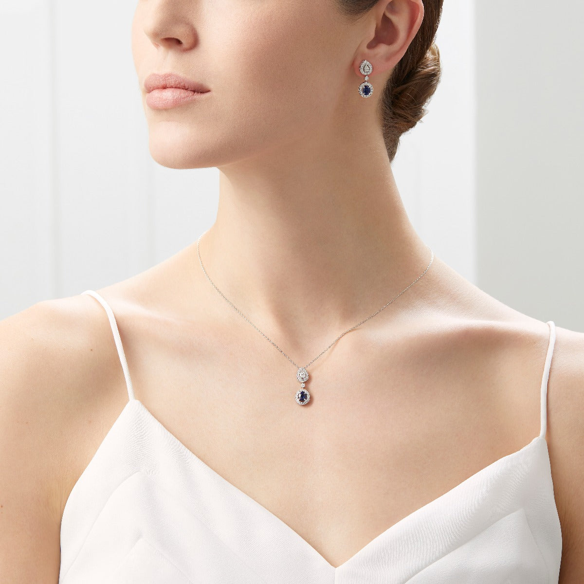 Platinum Drop Pendant with Oval Sapphire and Diamonds